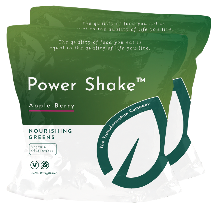 Two bags of Power Shake™ featuring Apple-Berry flavor, labeled as Nourishing Greens, vegan, and gluten-free.